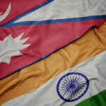 waving colorful flag of india and national flag of nepal.
